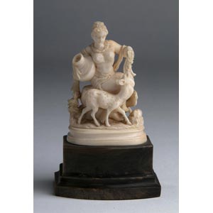 A carved ivory figure of a lady depicted ... 