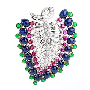 Gold leaf brooch with sapphires, emeralds, ... 