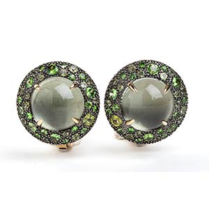 Pair of round gold and silver earrings with ... 