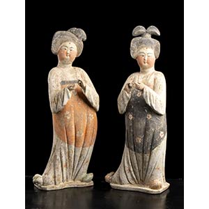 A PAIR OF PAINTED POTTERY FIGURES OF FAT ... 