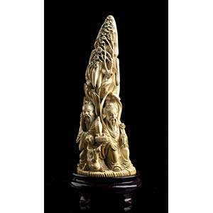AN IVORY GROUP WITH A MOUNTAIN AND ... 