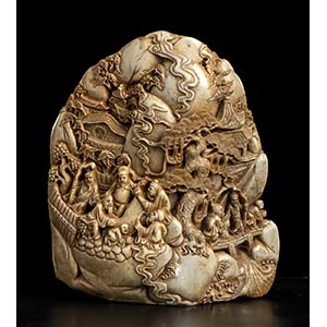A SOAPSTONE CARVING WITH FIGURES IN A ... 