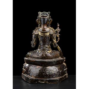 A BRONZE GUANYIN WITH TRACES OF ... 