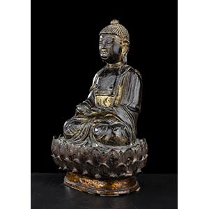 A BRONZE BUDDHA WITH TRACES OF ... 