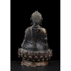 A BRONZE BUDDHA WITH TRACES OF ... 