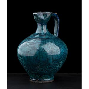A TURQUOISE GLAZED AND PAINTED CERAMIC ... 