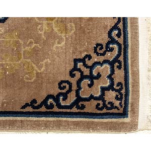 A OCHRE GROUND CARPET WITH FLORAL ... 