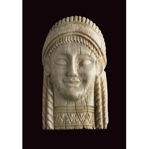 Ivory plaque in shape of Kore head ... 