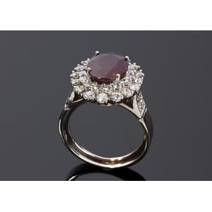 RUBY DIAMOND DOUBLE HALO GOLD RING; set with ... 