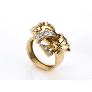GOLD DIAMOND RING; realized with ribbons ... 