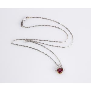 RUBY DIAMOND NECKLACE; set with an oval ... 