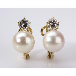 PEARL AND DIAMOND EAR CLIPS; set with ... 