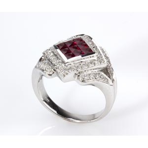 DIAMOND AND RUBY RING; shaped as a band with ... 