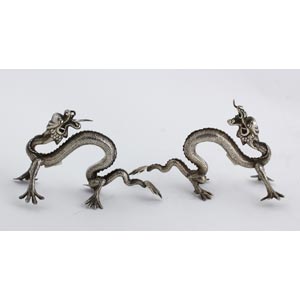 A PAIR OF ANTIQUE SOLID SILVER DRAGONS - ... 