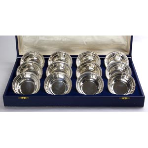 A SET OF  12 SOLID 800 ‰ SILVER  ... 