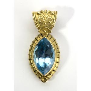 BLUE TOPAZ GOLD PENDANT; with a ... 