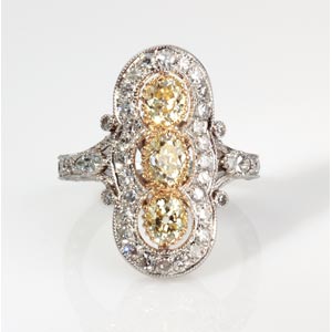 GOLD AND PLATINUM DIAMOND RING; ... 