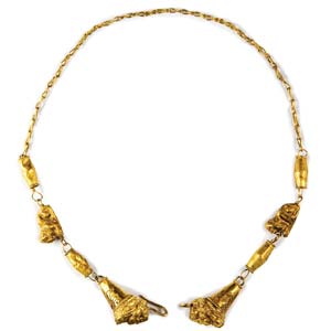 Gold necklace with lion’s heads ... 