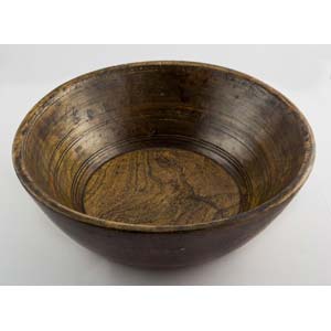Small wooden bowl which has been highly ... 