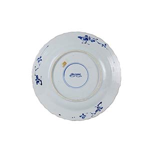A LARGE BLUE AND WHITE DISH WITH ... 