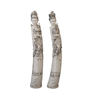 A PAIR OF LARGE IVORY CARVING OF TWO ... 