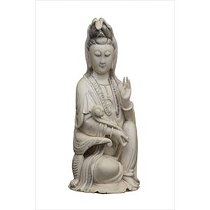 AN IVORY CARVING OF A SEATED GUANYINEarly ... 