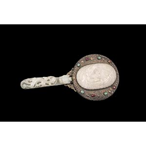 A LATE QING DYNASTY REPOUSSÉ SILVER, WHITE ... 