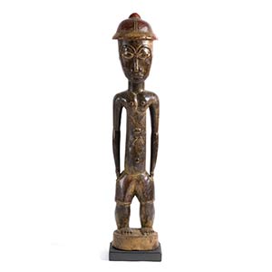 A BAULE WOODEN STANDING MALE FIGURE FROM ... 