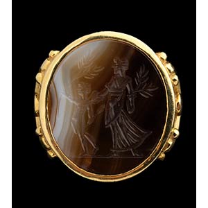 A banded agate intaglio, mounted ... 