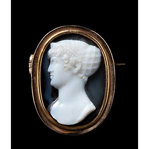 An onyx cameo, by A. Berini, mounted in a ... 