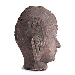 A LARGE STONE HEAD OF A ... 