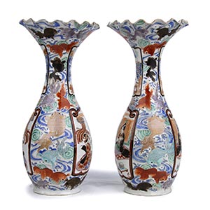 A PAIR OF POLYCHROME BALUSTER ... 