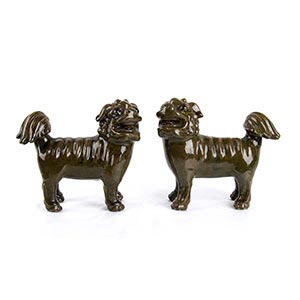 A PAIR OF GREEN-GLAZED BUDDHIST LIONS  ... 