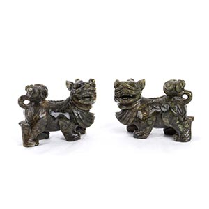 A PAIR OF GREEN STONE BUDDHIST LIONS  China, ... 
