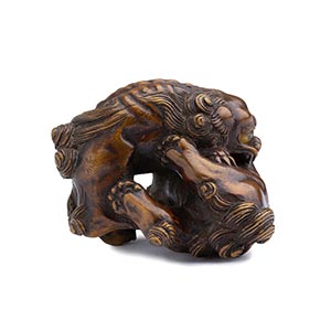 AN HORN INLAID WOOD NETSUKE OF TWO ... 