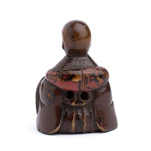 A LACQUERED WOOD NETSUKE OF A ... 