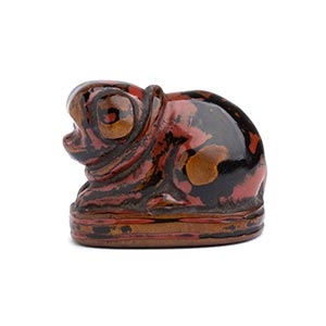 A LACQUERED WOOD NETSUKE OF A PUPPY19th ... 