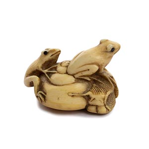 AN HORN INLAID IVORY NETSUKE OF A SNAIL AND ... 