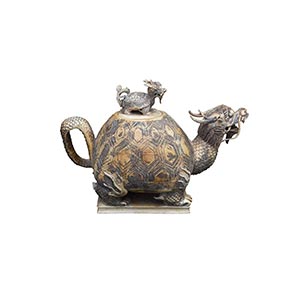 AN IVORY ‘TORTOISE’ TEAPOT AND ... 
