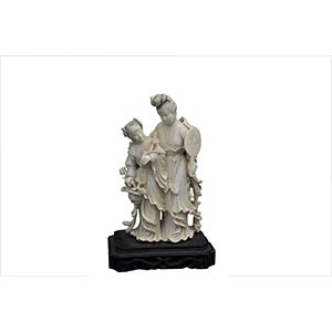 AN IVORY CARVING OF TWO STANDING FEMALE ... 