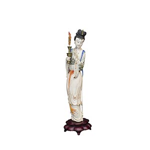 A PAINTED IVORY CARVING OF A STANDING ... 