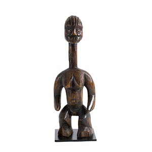 A WOODEN STANDING FEMALE FIGURE ... 
