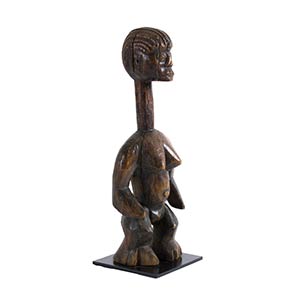 A WOODEN STANDING FEMALE FIGURE ... 