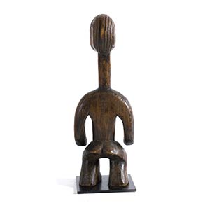 A WOODEN STANDING FEMALE FIGURE ... 