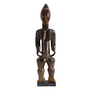 A BETE WOODEN FIGURE OF A STANDING ... 