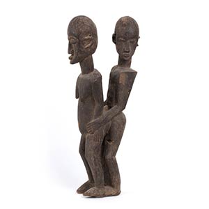 A WOOD SCULPTURE OF A MALE AND FEMALE ... 