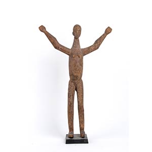 A WOOD SCULPTURE OF A FIGURE WITH ... 