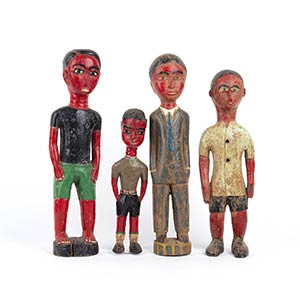 FOUR PAINTED WOOD SCULPTURES OF COLON MALE ... 