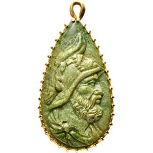 A green jasper cameo mounted with a gold ... 