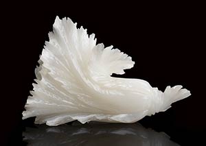 A WHITE JADE CARVING OF LEAVES ... 
